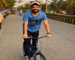 Raj enjoys riding a bike in his free time.